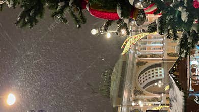 Russia, St. Petersburg, 15 December 2023 - a New Year's mood on Palace square, it is snowing on the New Year's