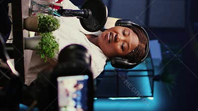 Vertical video Entertainers doing podcasting session with filming equipment