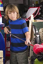 Boy Cleaning the Garage