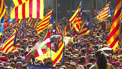 Crowd of People with Catalan Flags on the Street