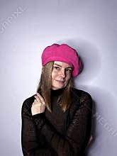 mature woman in a crimson beret and turtleneck