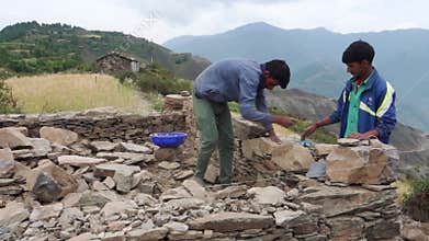 June 28th 2023,Nagthat, Uttarakhand, India. Local workers constructing a traditional home with stone in a countryside village.