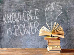 knowledge is power, books and blackboard with drawing of a fist power symbol,education,learning,reading,idea,back to school