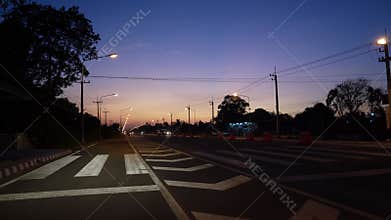 Traffic near the road side in evening sky shade.