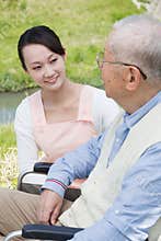 Japanese caregivers and senior speak in the field