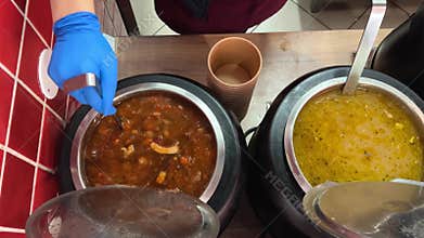 Romanian cuisine different types of soups in pots scoop with a ladle scatter on plates stir delicious aromatic food