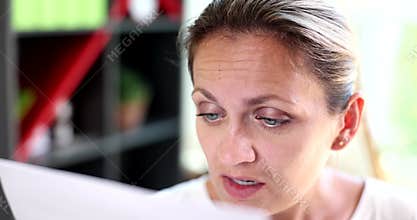 Portrait of confused business woman squinting, seeing better