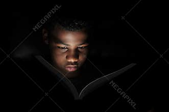 Boy reading at night