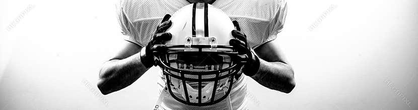 American Football runningback quarterback take a helmet