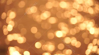 Abstract Blurred video screensaver bokeh golden sea at sunset. The sun reflects and sparkles on the waves.