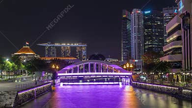 Skyline of Singapore financial district behind Elgin Bridge and the Singapore River night timelapse hyperlapse