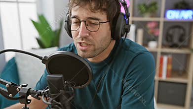 A focused man podcasting with a microphone in a home studio setting, showcasing technology and communication
