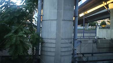 Movement on car under many concrete bridges in