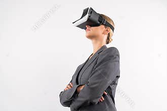 Caucasian businesswoman crossing arms while wearing VR glasses. Contraption.