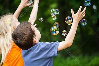 Kids blowing bubbles