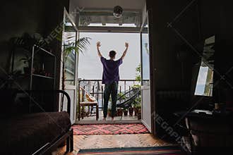 Enjoying a peaceful morning stretch on the balcony, with a view of the cityscape