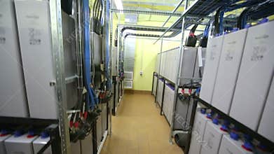 Aisle between racks with accumulators of backup