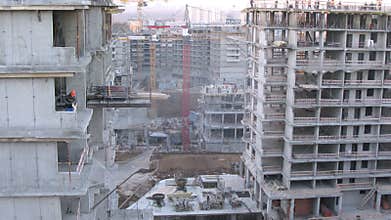 Constructing site during the day, zoom in.