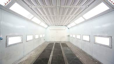 Simple paint-spraying booth with metal walls for