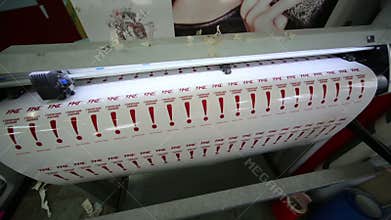 Plotter in printing house prints image with