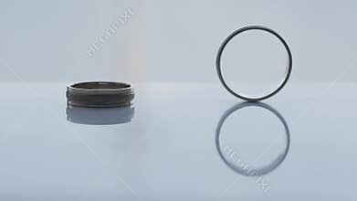 Wedding rings rolling on table in slow motion, wedding day