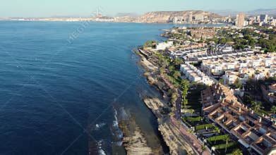 14 August 2024 Alicante, Cabo de Huertas, drone footage of the sea and elite villas on a rock