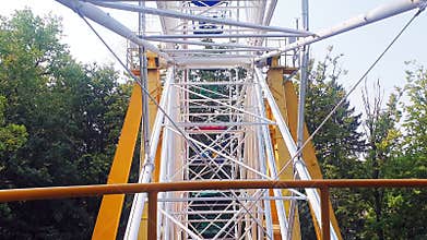 Areal slow motion footage of ferris wheel. Entertainment