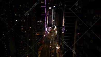 Hong Kong - 1 Jul 2024. Aerial View Urban City at Night Bright Illuminated