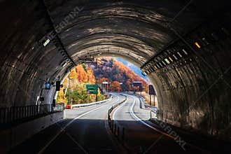 Takayama, Japan-November, 2019 The tunnel on a highway leads to Takayama from Shirakawa. Beautiful autumn view of the road through