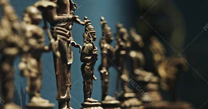 Row Of Old Ancient Bronze Figurines Of Indian Deities And Avatars. 18-19th Century Ce. Close-up View On Vamana Avatara