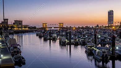 Yachts and boats at the Sharq Marina night to day timelapse in Kuwait. Kuwait City, Middle East