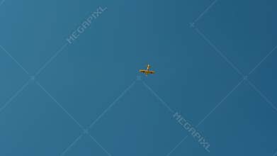 Yellow Aircraft is Flying