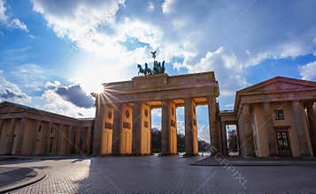 Brandenburger Tor on blue sky with clouds in Berlin, Germany.