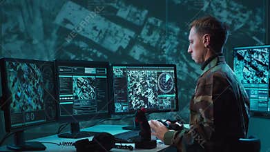 Military soldier operating advanced technology in a command center.