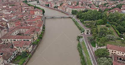 Aerial view of the cityscape of Verona on both banks of the Adige river, Italy.