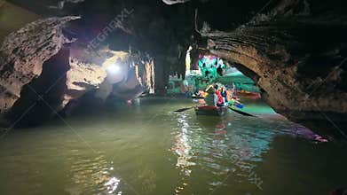 Inside view out of natural cave in Tam Coc scenic spot, Ninh Binh, Vietnam.