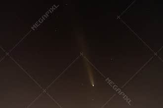 A comet soars through the night sky