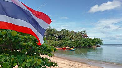 Thailand, Phuket, 14 November 2023 - The coast of Thailand on a sunny day, few fishing boats on the shore of the blue