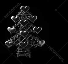 Christmas tree made from sticks and golden hearts