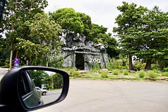 Thailand Korat zoo entrance sign gates , Nakhon Ratchasima Zoo sign front gate park , on car driving.