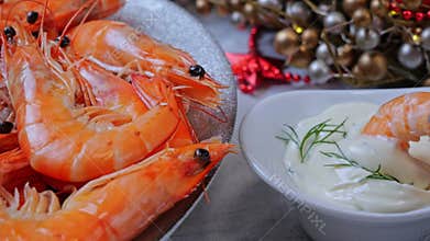 Cooked shrimps on a plate, Christmas New Year decoration. Shrimp dipped in white sauce mayonnaise