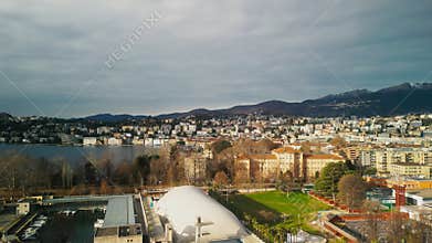 Aerial View of Small Harbor in Lugano, Switzerland. Drone View of Breathtaking Landscape with Trees and Town of Lugano