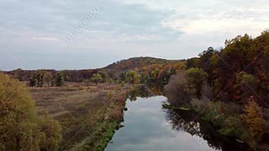 Autumn aerial river valley with colorful forest
