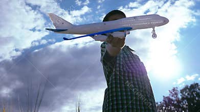 Skyward Dreams: Boy Playing with Toy Plane, Aspiring to Be a Pilot in the Evening