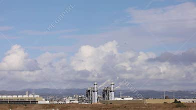 Time lapse of clouds near industries in Hayward California