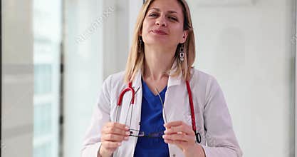 Smiling woman doctor taking off vision glasses portrait 4k movie slow motion