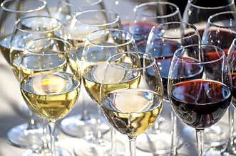 Glasses with white and red wine close-up
