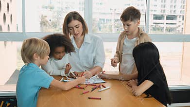 Student and teacher drawing and coloring by using marker or crayon. Erudition.