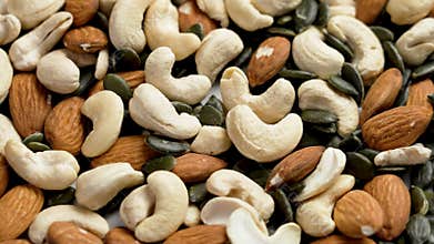 Mixed nuts abundance with cashew, almonds and pumpkin seeds