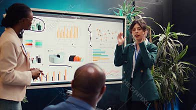 Team of business colleagues discussing agenda for upcoming events